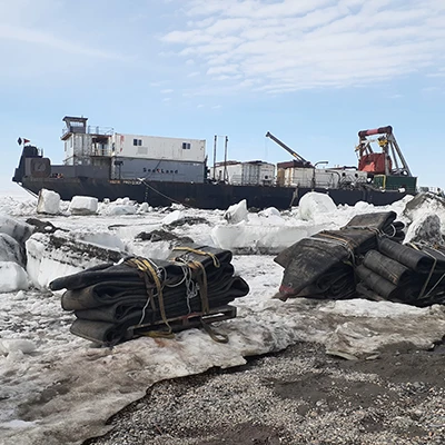 Vessel surrounded by ice and parts